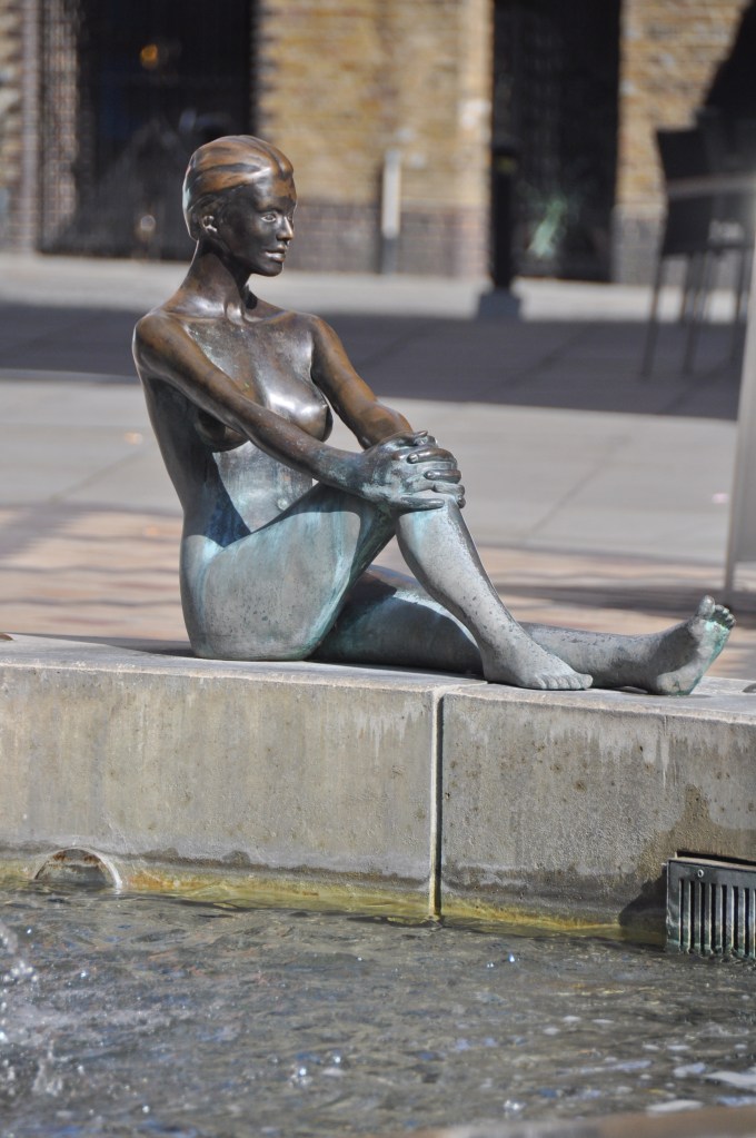Woman sculpture in Fountain at Tower Bridge Plaza