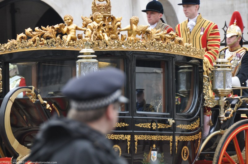 The Queens Coach in Whitehall - watched by the Police
